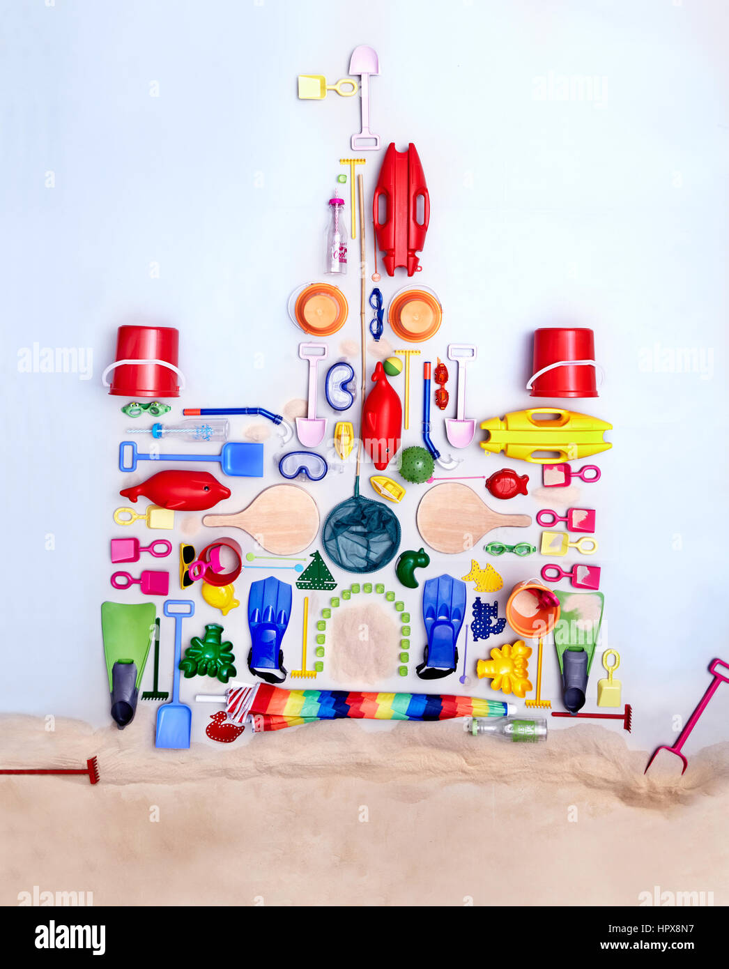 Still life concept beach toys forming sand castle Stock Photo