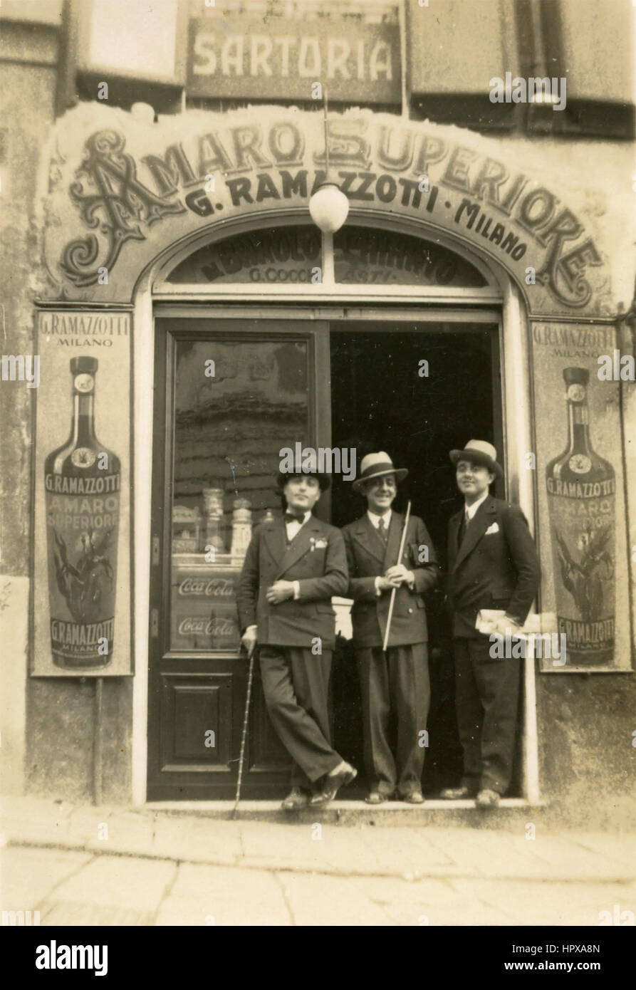 Three friends out of a bar, Italy Stock Photo