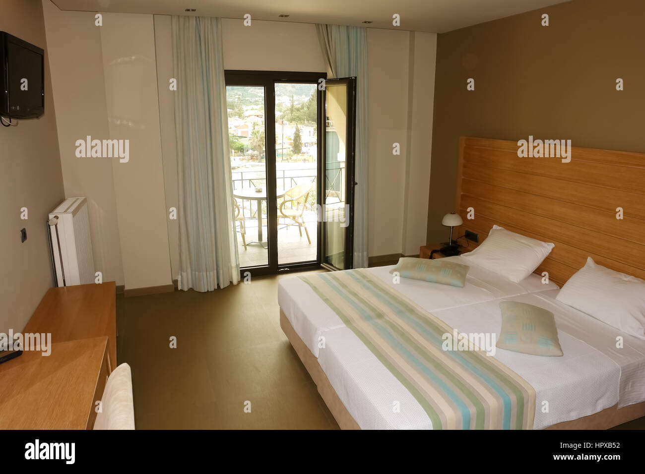 Sivota, Greece May 09, 2013 Interior room with a large bed in a modern Greek hotel Stock