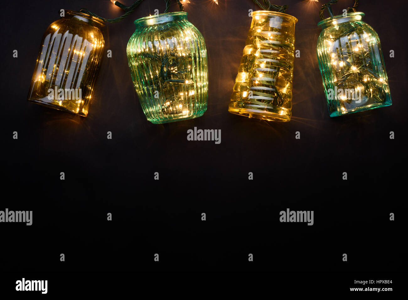 New Year Lights Garland In Glass Vases As A Decorative Frame For