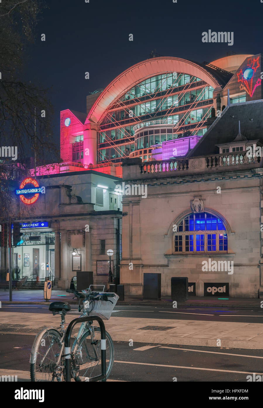 Embankment underground station by the River Thames at night Stock Photo