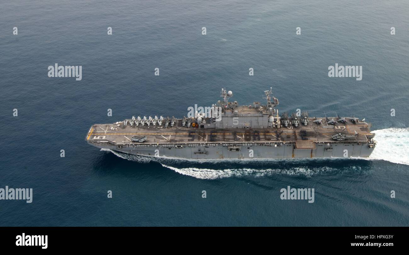 Sailors and Marines aboard amphibious assault ship USS Peleliu (LHA 5 ...