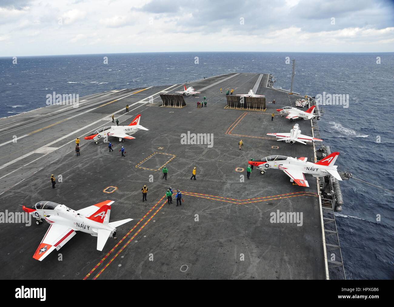 Three aircrafts prepare to launch of off of the flight deck of the aircraft carrier USS Harry S. Truman, underway supporting carrier qualifications, November 6, 2012. Image courtesy Anthony Presley/US Navy. Stock Photo