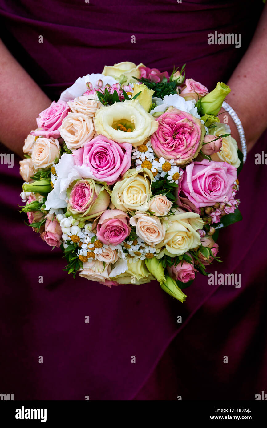 bride holding wedding bouquet with roses Stock Photo - Alamy