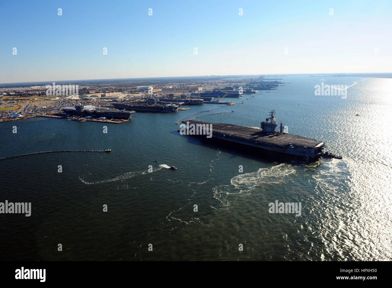 The Nimitz-class aircraft carrier USS Dwight D Eisenhower makes its approach pier side at Naval Station Norfolk, Virginia, December 19, 2012. Image courtesy US Navy Mass Communication Specialist 3rd Class Kevin J Steinberg. Stock Photo