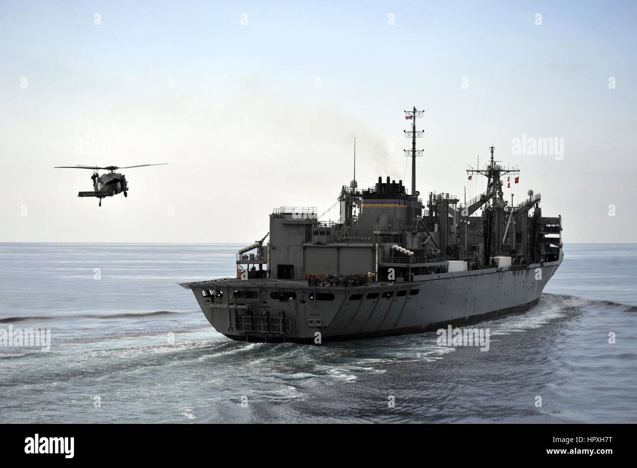 An SH-60B sea hawk helicopter approaches USNS Bridge at sea, December 19, 2012. Image courtesy of US Navy Mass communication specialist 2nd class Deven B King. Stock Photo