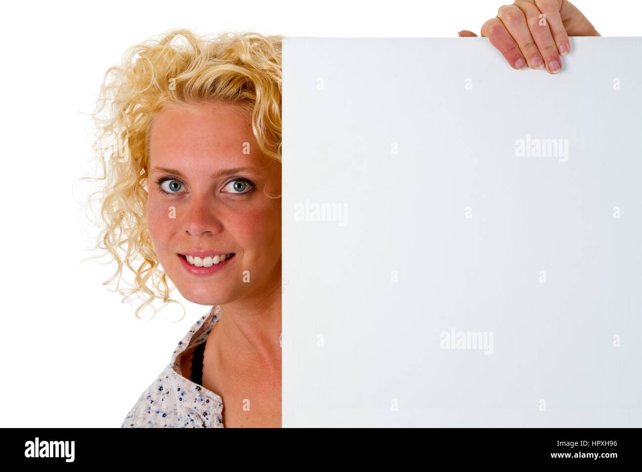 Young woman holding blank white message board isolated on white
