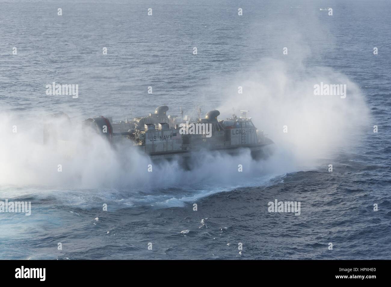 A landing craft air cushion (LCAC) departs the well deck of the amphibious assault ship USS Bonhomme Richard, East China Sea, January 26, 2012. Image courtesy Adam Wainwright/US Navy. Stock Photo