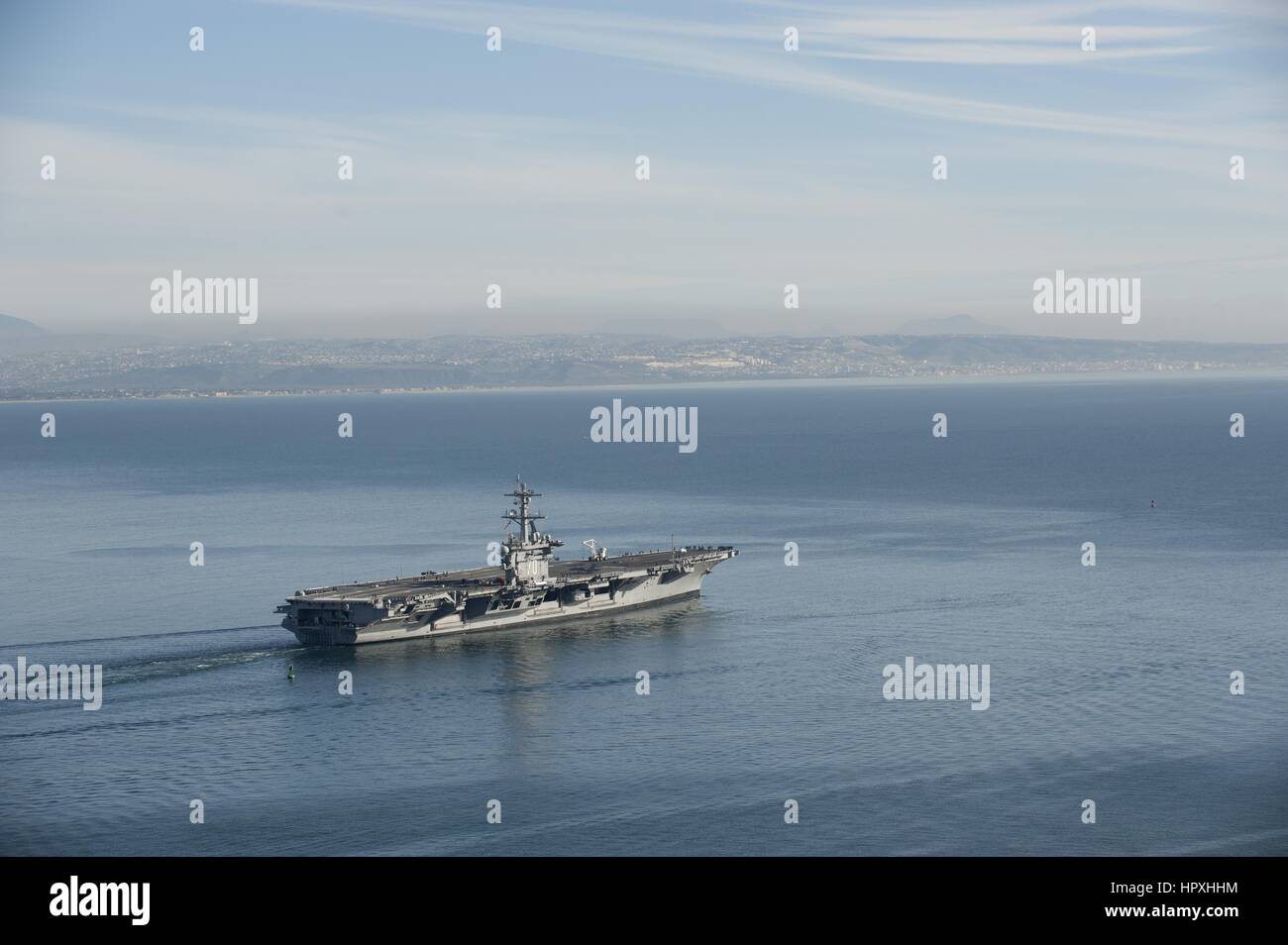 The aircraft carrier USS Carl Vinson gets underway from Naval Air Station North Island to conduct sea trials, Pacific Ocean, February, 2013. Image courtesy of Lowell Whitman/US Navy. Stock Photo
