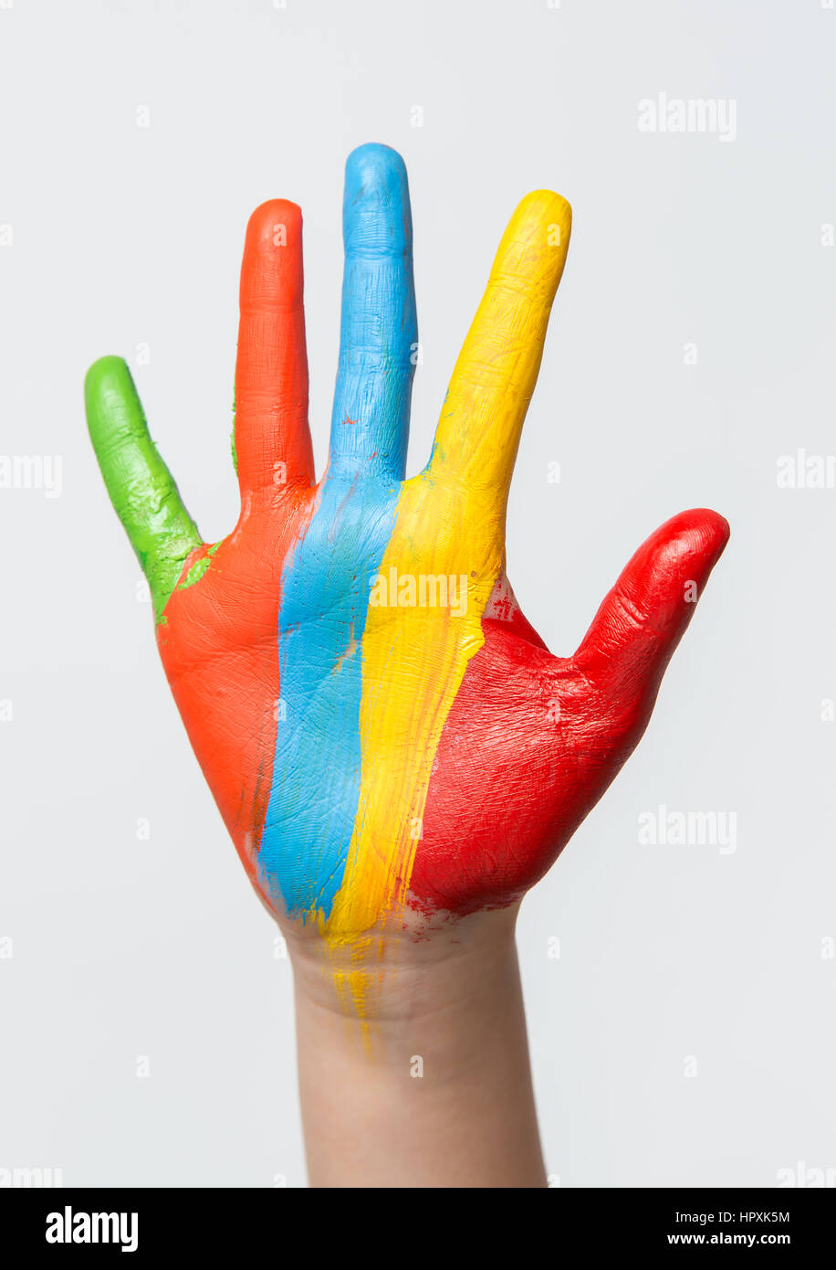 A painted children hand, isolated on white background Stock Photo