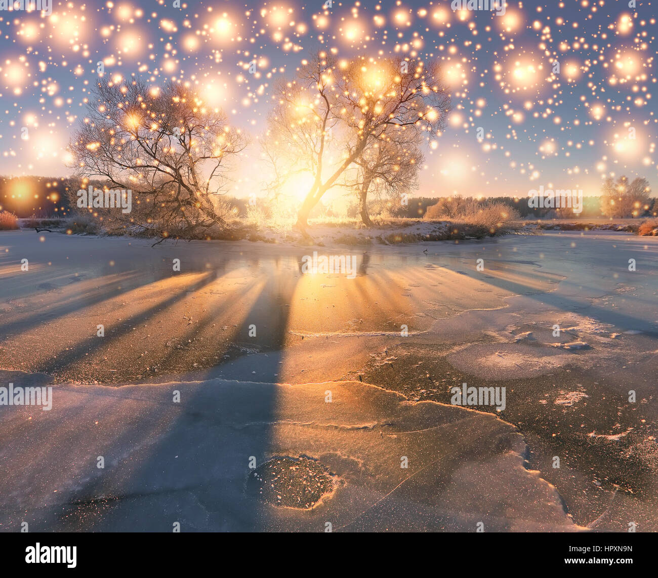 Christmas winter background. Snowy winter morning. Morning sun illuminate xmas lights. Stock Photo