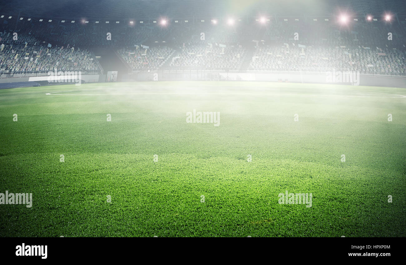 Empty football stadium in fog and spotlights. Mixed media Stock Photo
