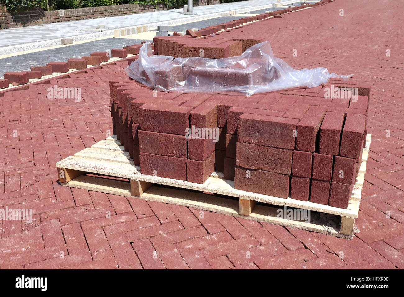 pallet of cobbles at construction site in residential zone Stock Photo