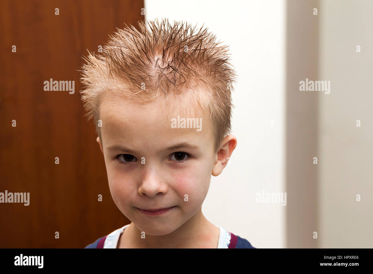 Portrait of a boy with wet hair after taking a shower of bath. Funny boy  with crazy hairstyle Stock Photo - Alamy