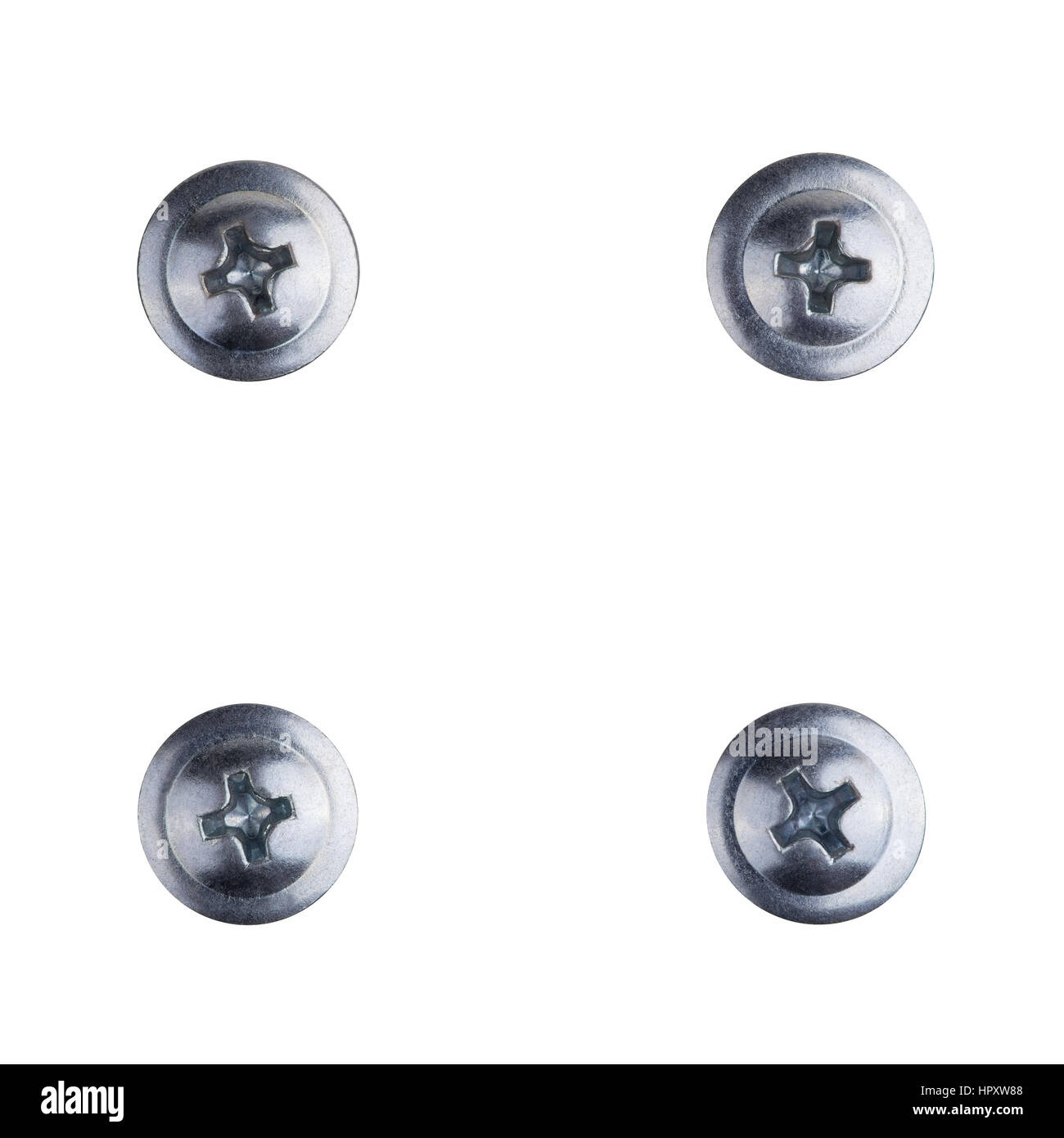 Four screw heads of silver color with path for the cross screw-driver Stock Photo
