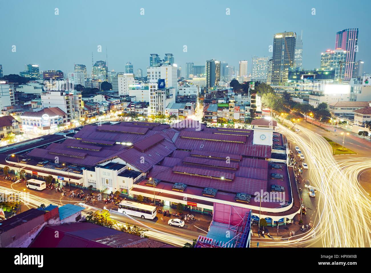 HO CHI MINH CITY, VIETNAM - DEC 16, 2015: Skyline and night traffic near Quach Thi Trang park in Ho Chi Minh City which is the largest city in Vietnam Stock Photo