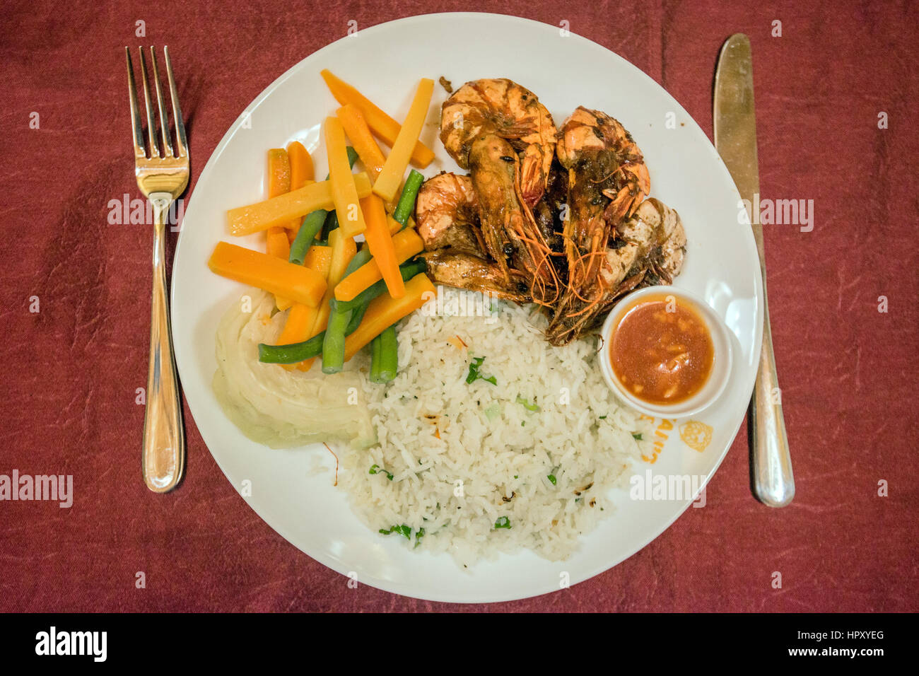 Close up of prawn with rice, vegatables and sauce Stock Photo - Alamy