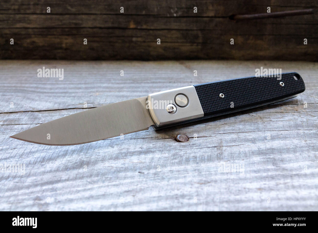 Flick knife with a black handle. Switchblade Stock Photo Alamy