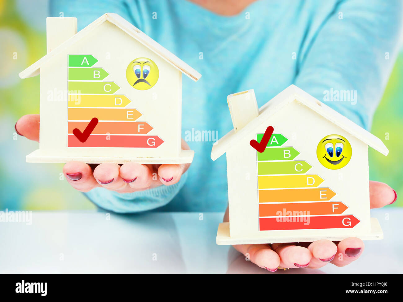 concept comparison between normal house and low consumption house with energy efficiency rating Stock Photo