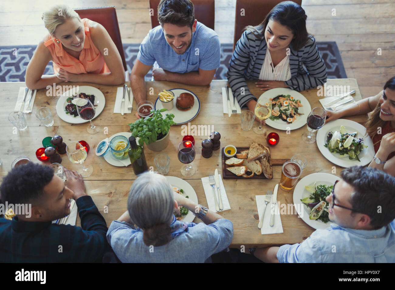 Group people sitting dining table hi-res stock photography and images ...
