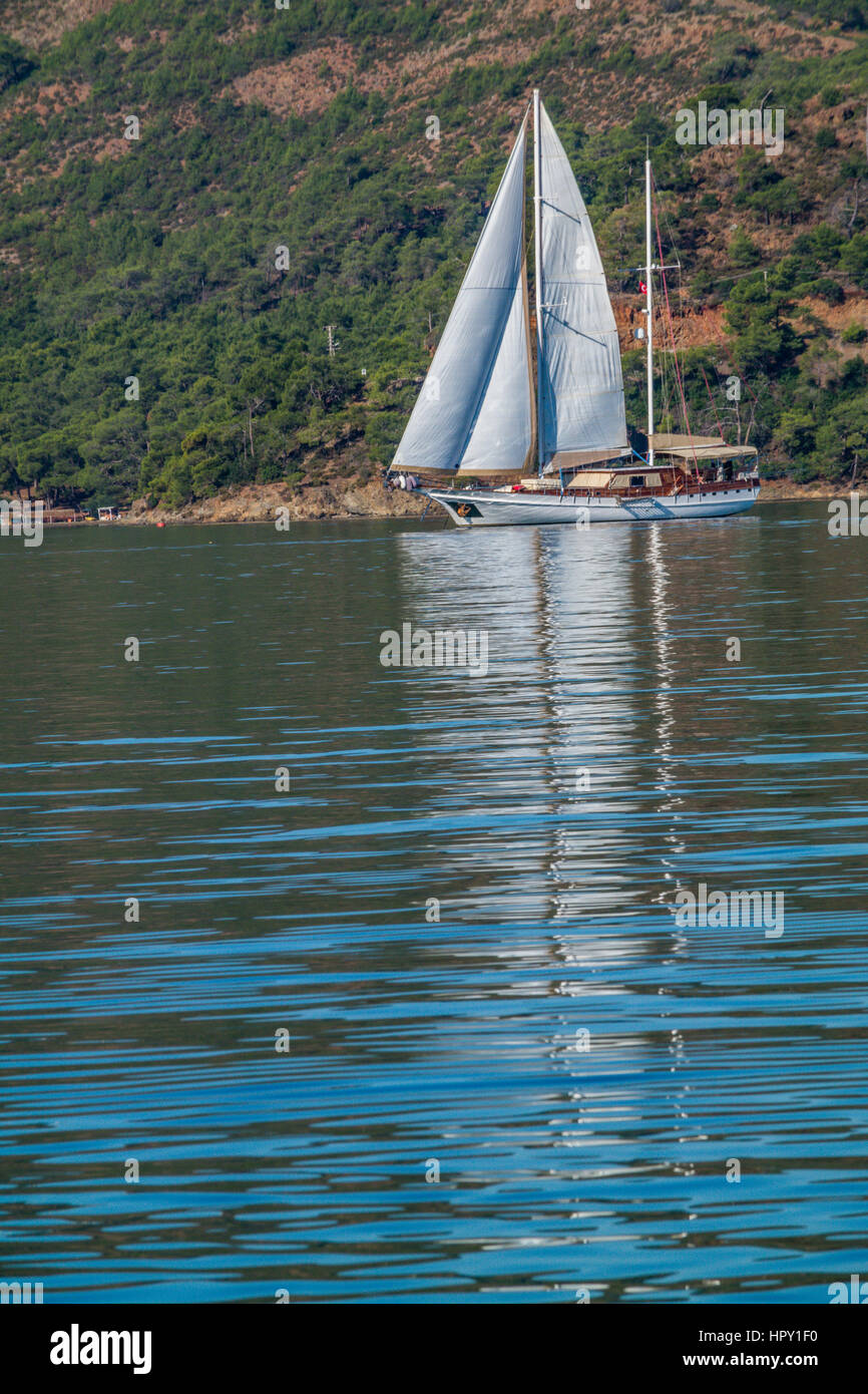 yacht charter in turkey and greece, white yacht set sail, mavi tur