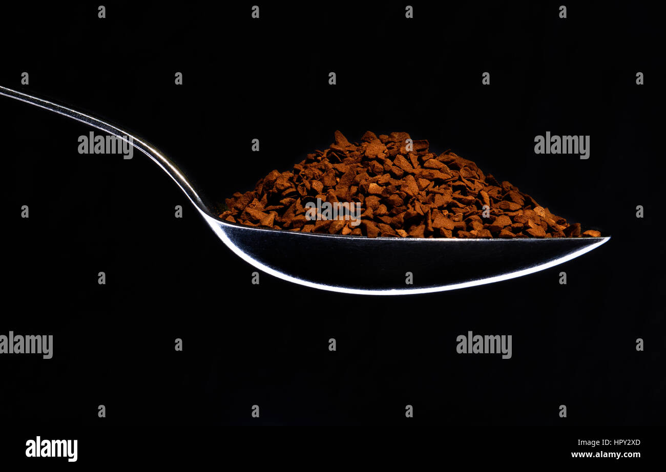 Spoon full of instant coffee Stock Photo