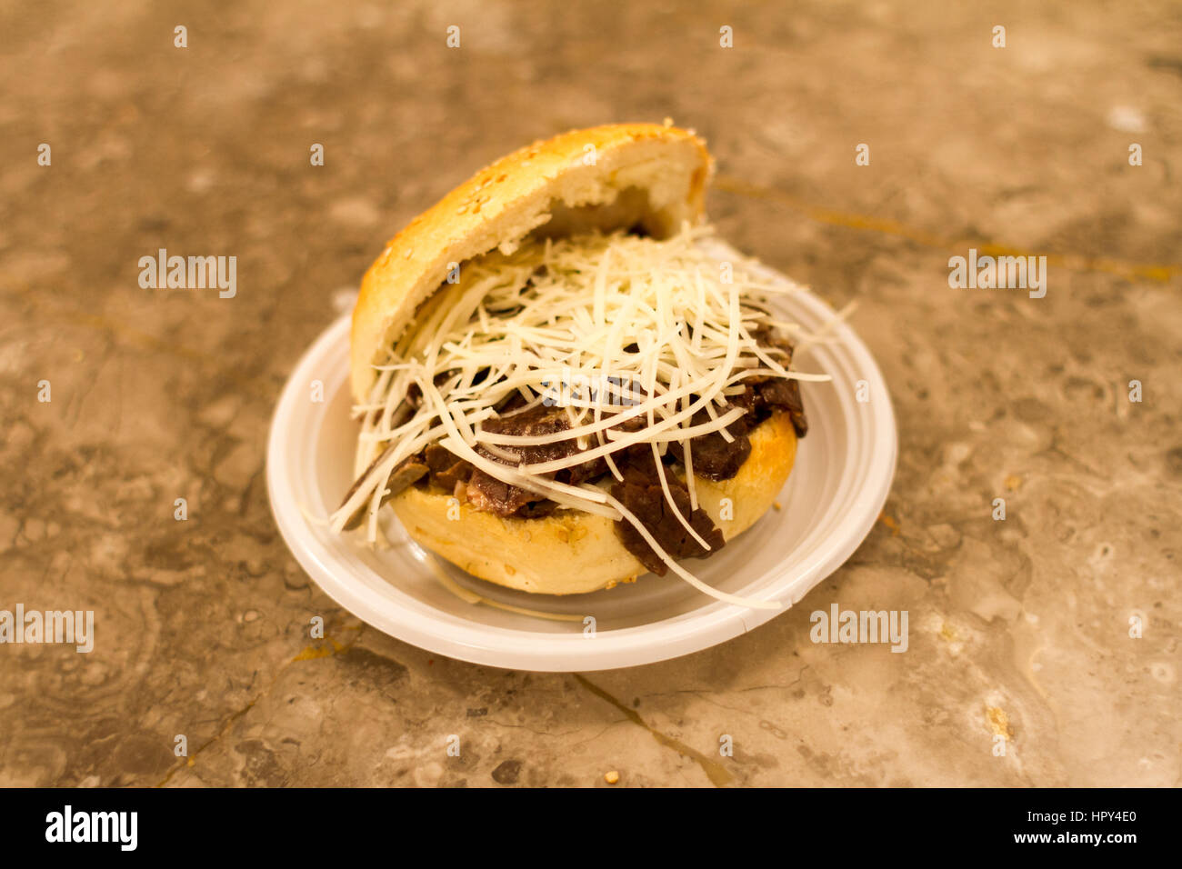 'Pani ca meusa' is a Sicilian street food. Literally, its name means 'bread with spleen'; its Italian name is 'panino con la milza' Stock Photo