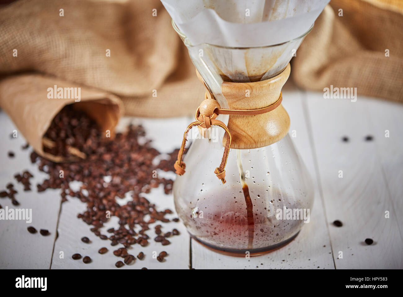 Brewign third wave coffee with chemex glass and drip kettle for pure flavor  in good design on wooden table Stock Photo - Alamy