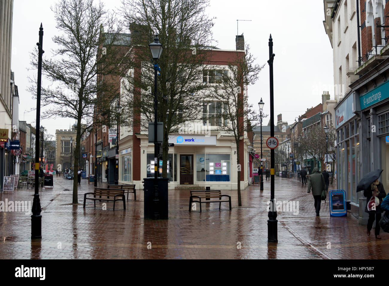 View from Market Place towards High Street and Sheep Street in wet weather, Rugby, Warwickshire, England, UK Stock Photo