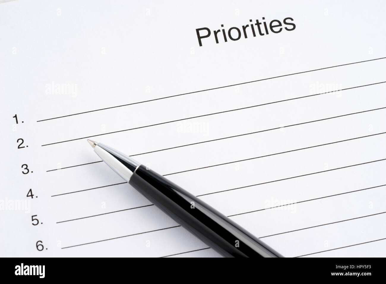 Close-up blank list of priorities and, pen Stock Photo