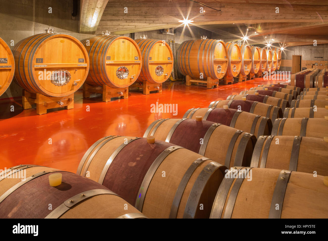 TRNAVA, SLOVAKIA - MARCH 3, 2014: Casks from indoor of modern wine cellar of great Slovak producer 'Mrva and Stanko'. Stock Photo