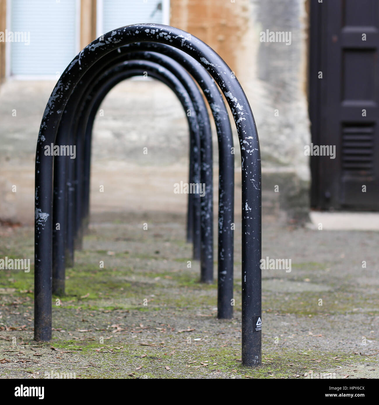 Jowett Walk, Oxford, United Kingdom, February 19, 2017: Empty black painted bicycle parking metal frames on the street in Oxford, England Stock Photo