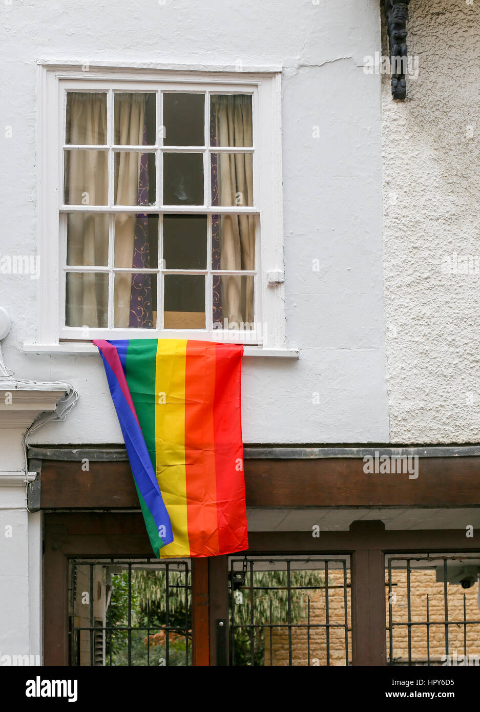 Hollywell street, Oxford, United Kingdom, February 19, 2017: Rainbow flag on Holywell street collage white window in Oxford, England Stock Photo