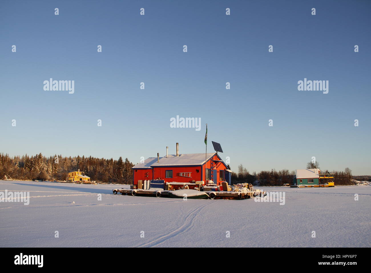 Red houseboat on Yellowknife Bay in Great Slave Lake, Yellowknife, Northwest Territories Stock Photo
