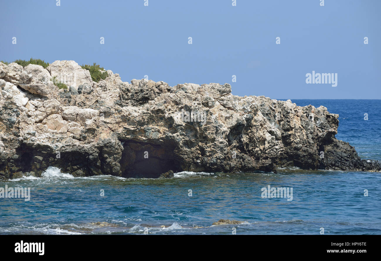 Jagged Volcanic Rock on Small Island off North East Coast of Akamas Peninsula, Cyprus Stock Photo