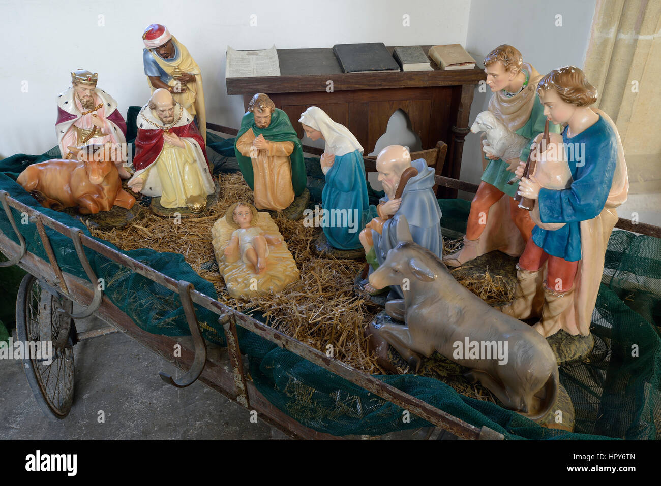 Nativity scene in old hay wagon, St James Medieval Church Chuch End