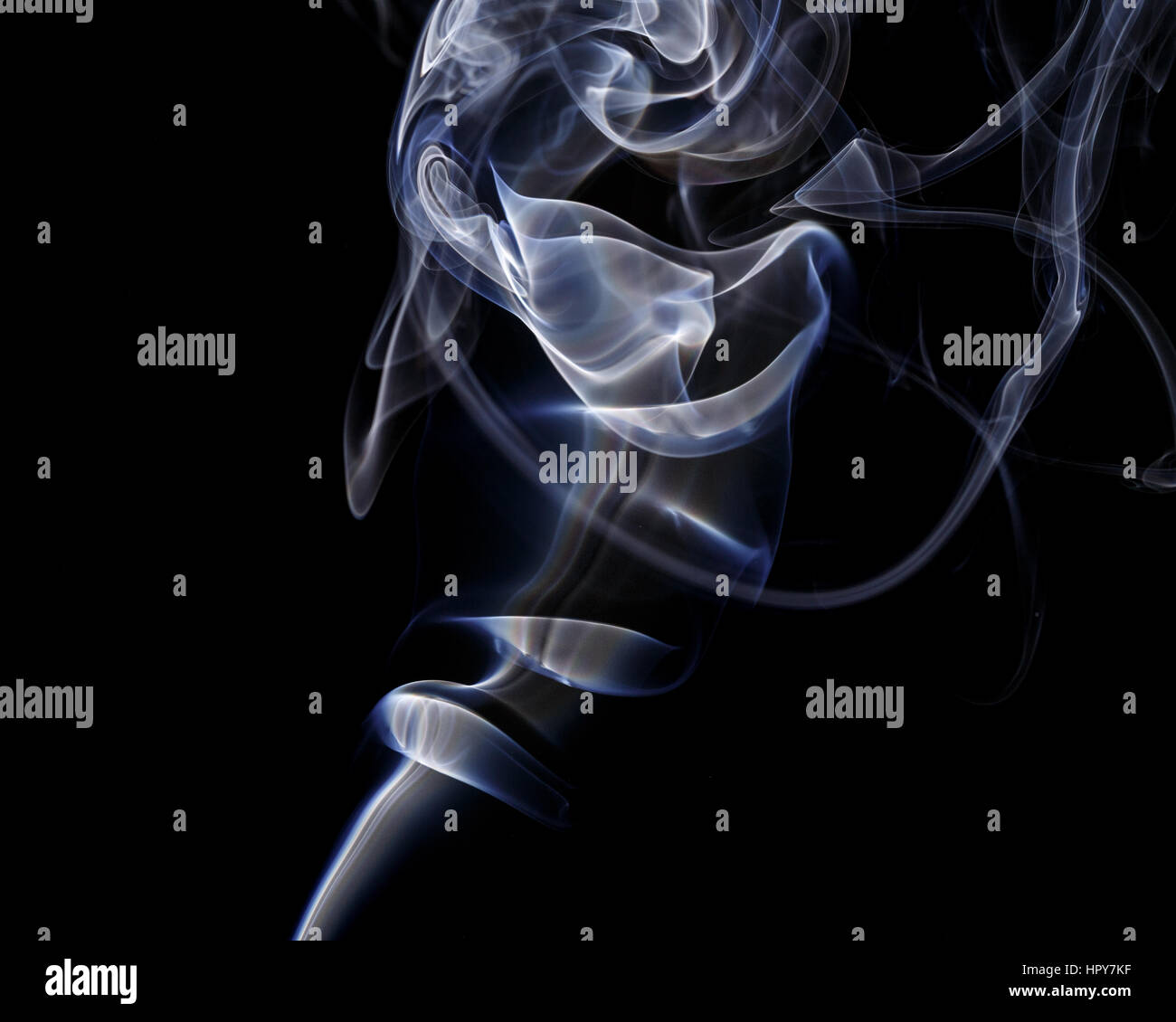Abstract art. Color white blue smoke from the aromatic sticks on a