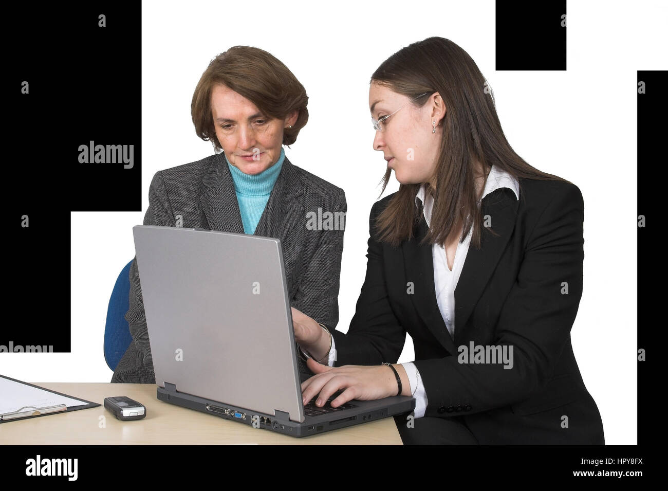 business female partners with laptop over a white background Stock Photo