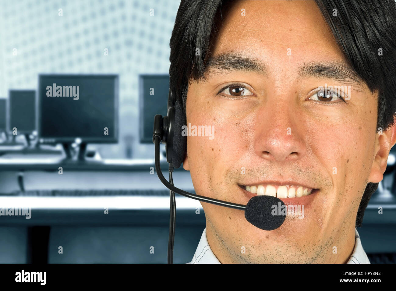 friendly customer services guy in a computer room Stock Photo Alamy