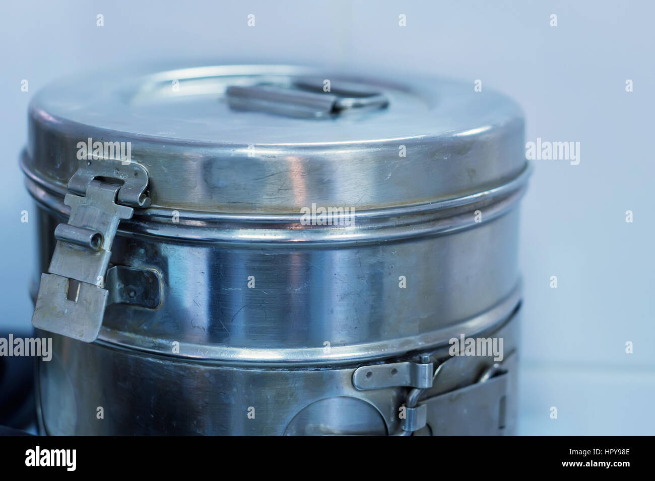 Medical crumpled and scratched round metal box for sterilization