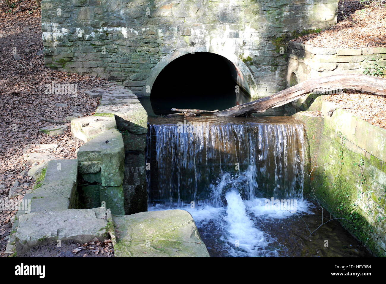 A stream coming out of a tunnel feeding the now disused Glamorgan Canal. Stock Photo