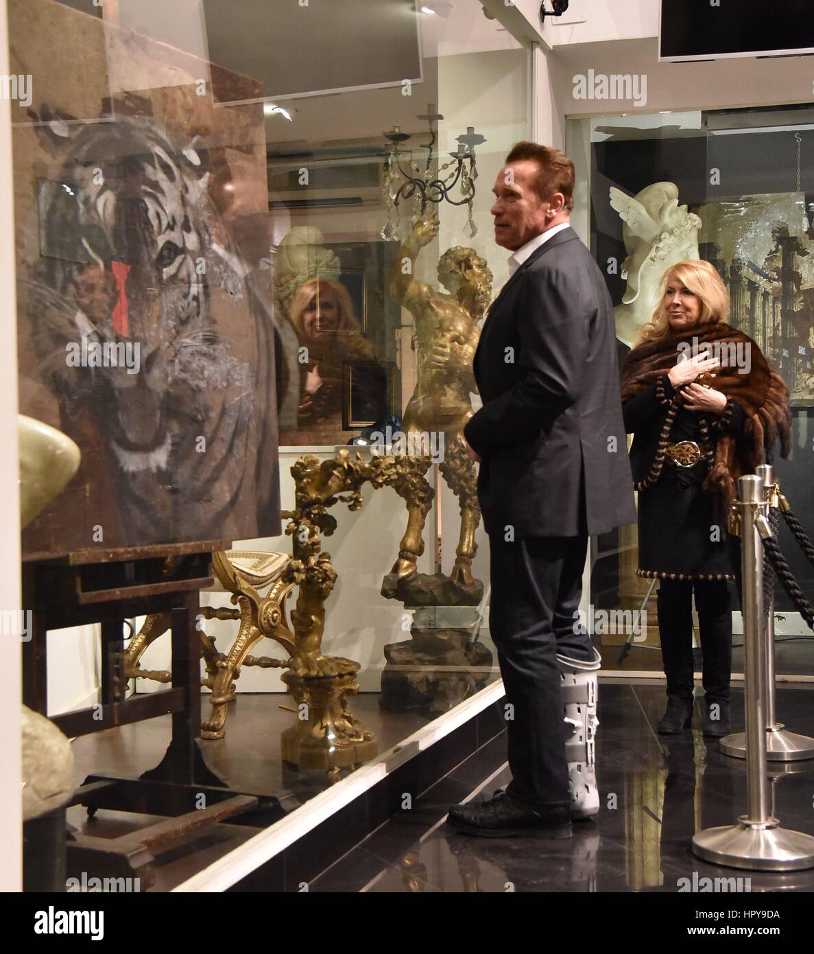 Arnold Schwarzenegger and his girlfriend Heather Milligan go shopping at various boutiques in Rome, Italy. Arnold is seen wearing a Air Shield Walker on his right leg and happily walks around the city centre.  Featuring: Arnold Schwarzenegger Where: Rome, Italy When: 25 Jan 2017 Credit: IPA/WENN.com  **Only available for publication in UK, USA, Germany, Austria, Switzerland** Stock Photo