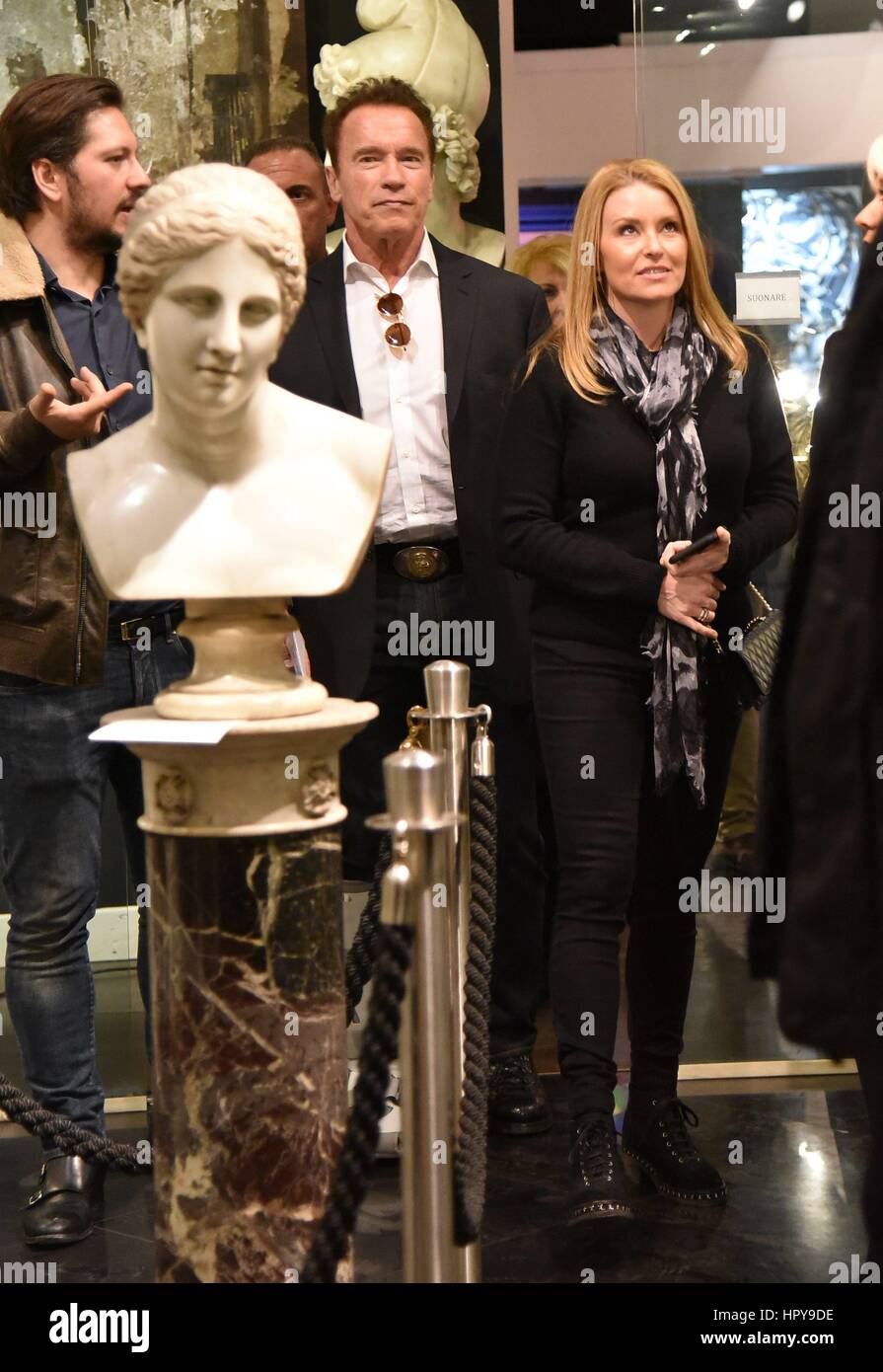 Arnold Schwarzenegger and his girlfriend Heather Milligan go shopping at various boutiques in Rome, Italy. Arnold is seen wearing a Air Shield Walker on his right leg and happily walks around the city centre.  Featuring: Arnold Schwarzenegger, Heather Milligan Where: Rome, Italy When: 25 Jan 2017 Credit: IPA/WENN.com  **Only available for publication in UK, USA, Germany, Austria, Switzerland** Stock Photo
