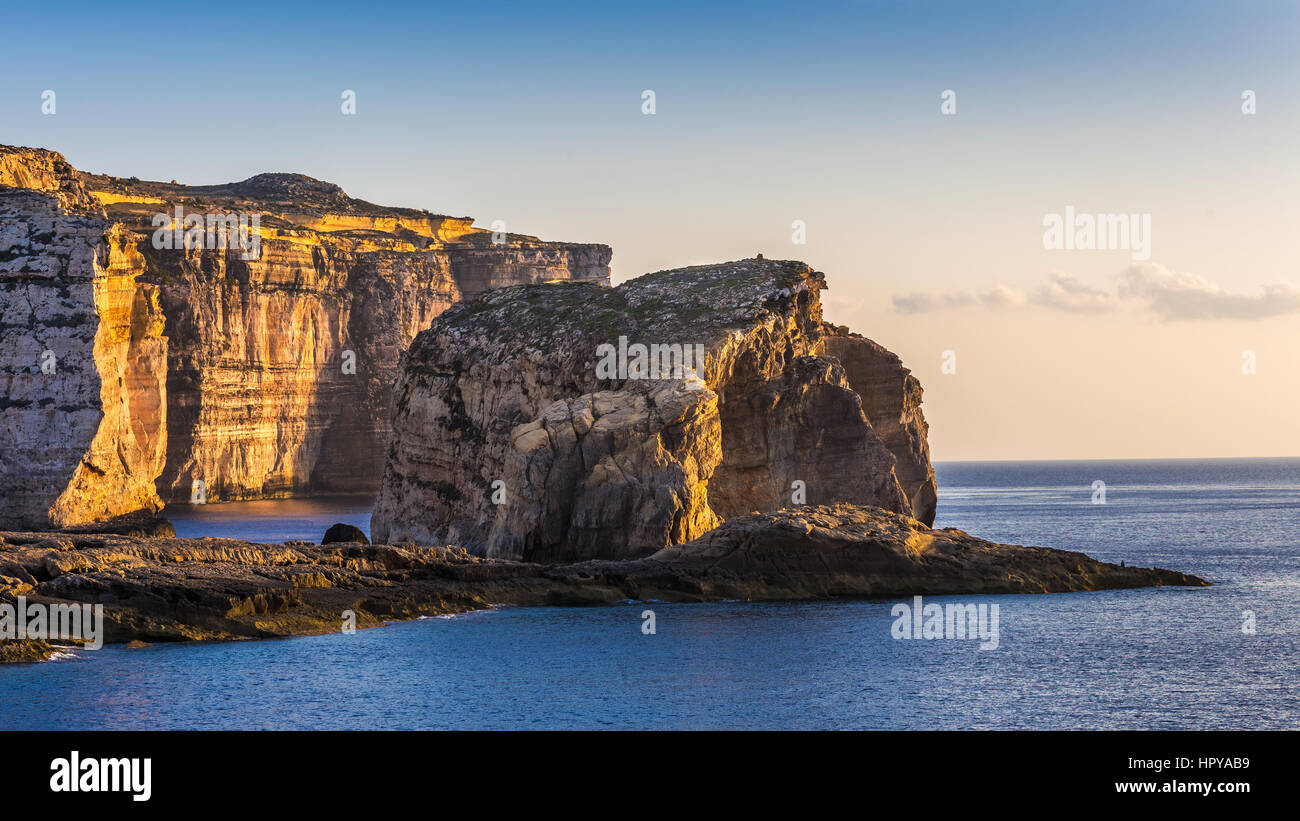 Gozo, Malta - The famous Fungus rock on the island of Gozo at Dwejra bay at sunset Stock Photo