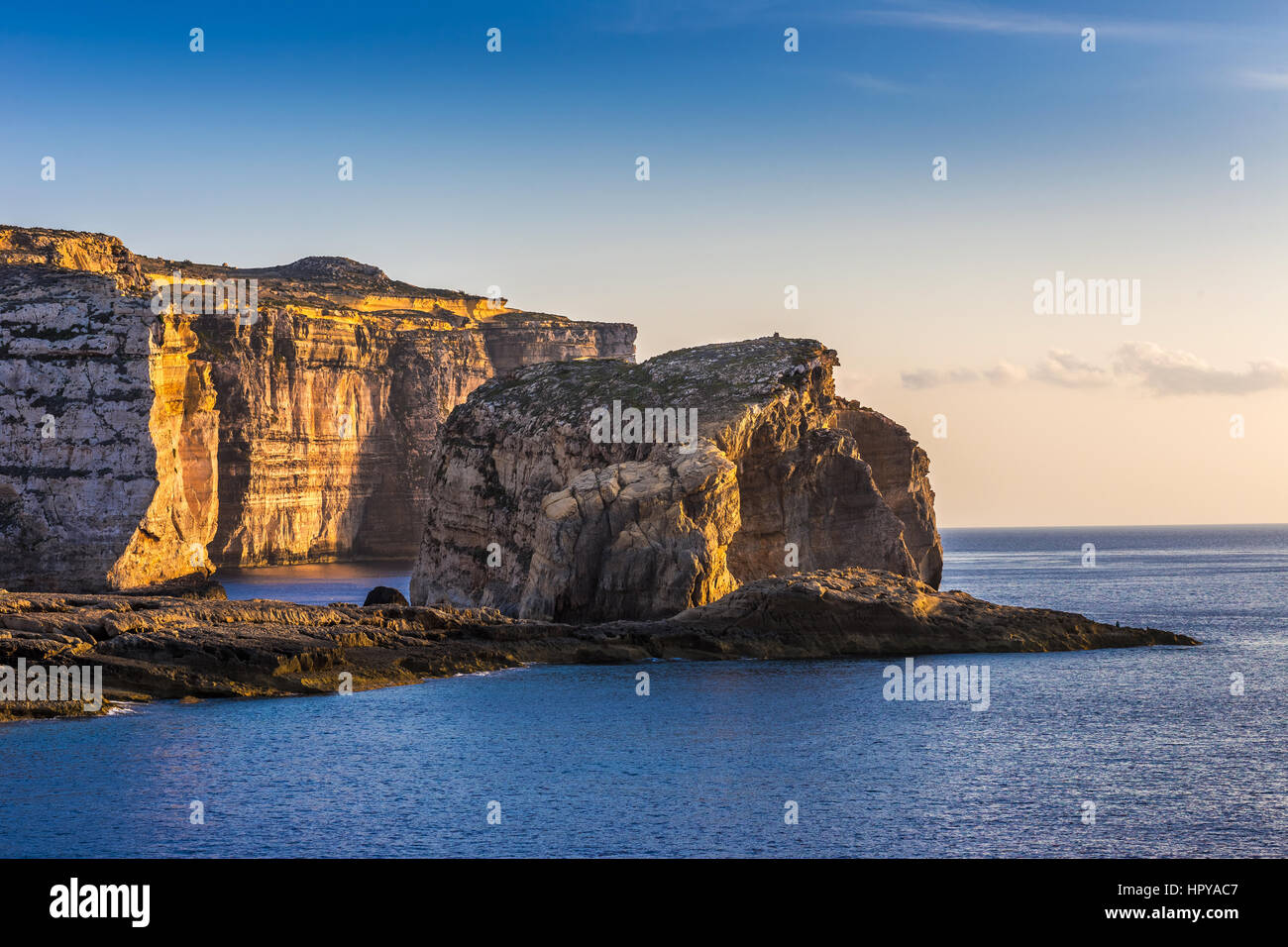 Gozo, Malta - The famous Fungus rock on the island of Gozo at Dwejra bay at sunset Stock Photo