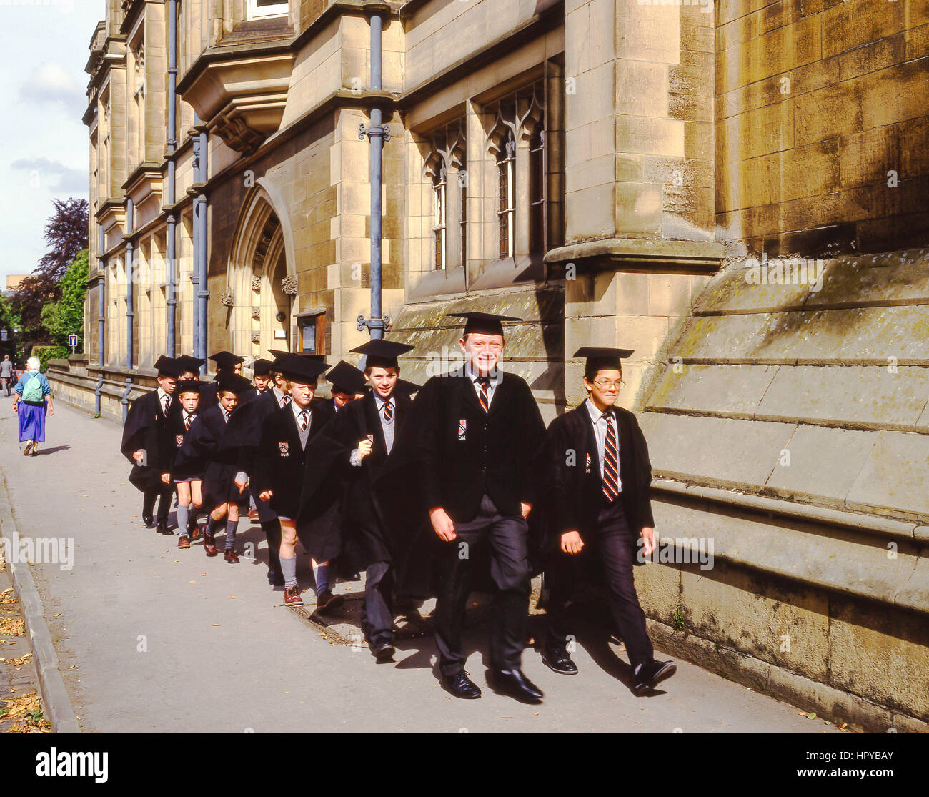 Secondary school boys in gowns on High Street, Oxford, Oxfordshire, England, United Kingdom Stock Photo