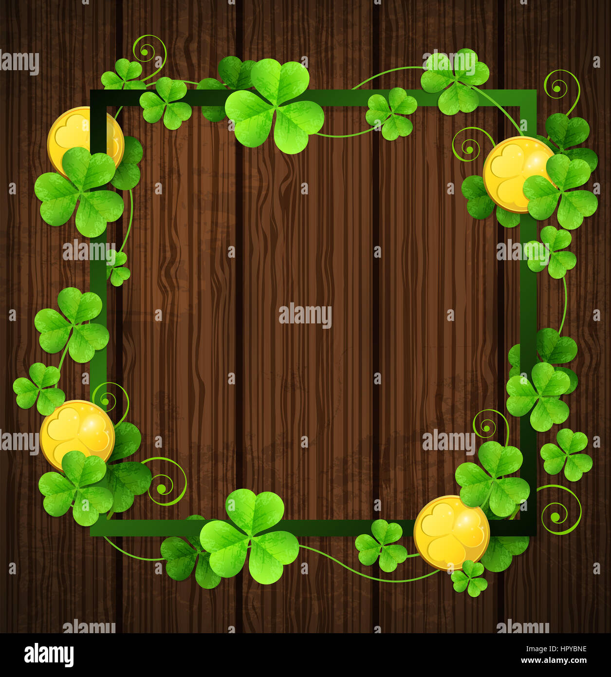 Clover leaves and golden coins in green frame on a wooden background ...