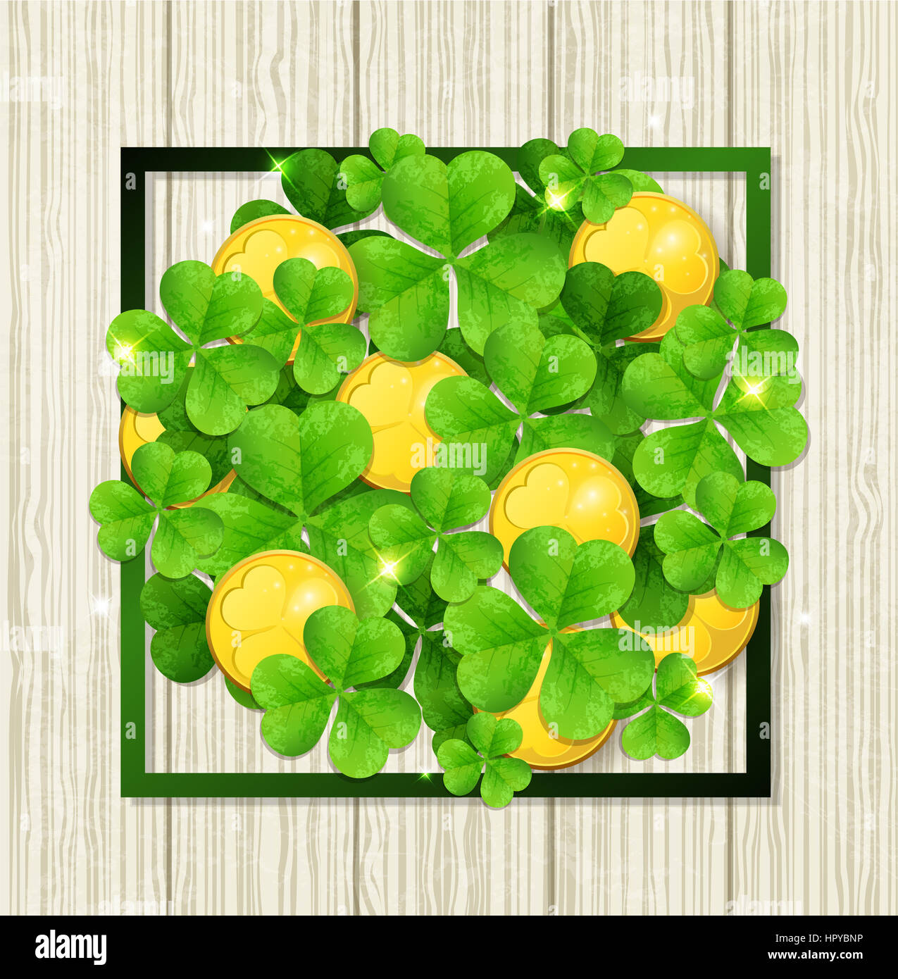 Clover leaves and golden coins in green frame on a wooden background ...