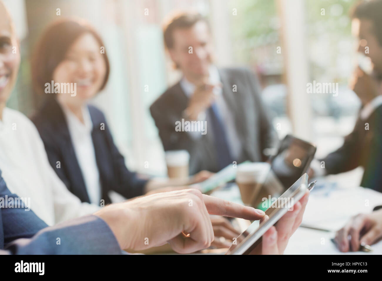 Businessman touching digital tablet in conference room meeting Stock Photo