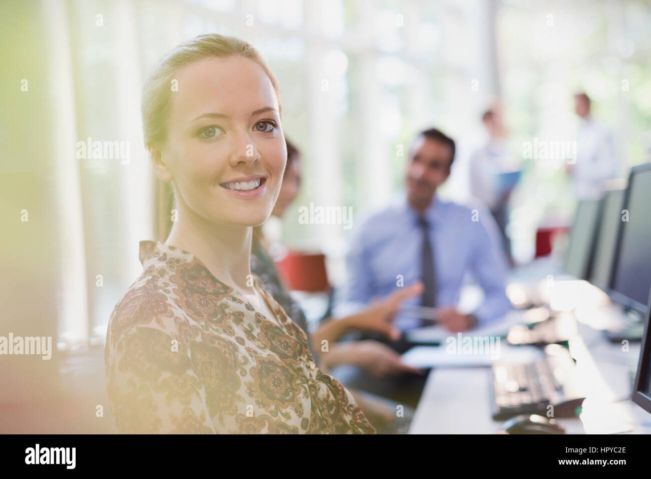 Portrait smiling businesswoman working in office Stock Photo - Alamy